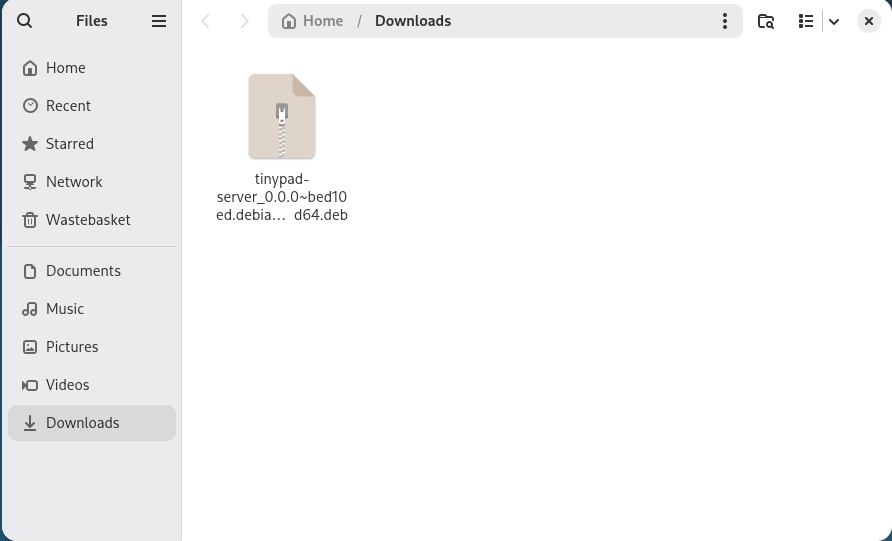 The Tiny Pad .deb package shown in the Files app Downloads folder