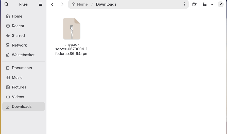 The Tiny Pad .rpm package shown in the Files app Downloads folder