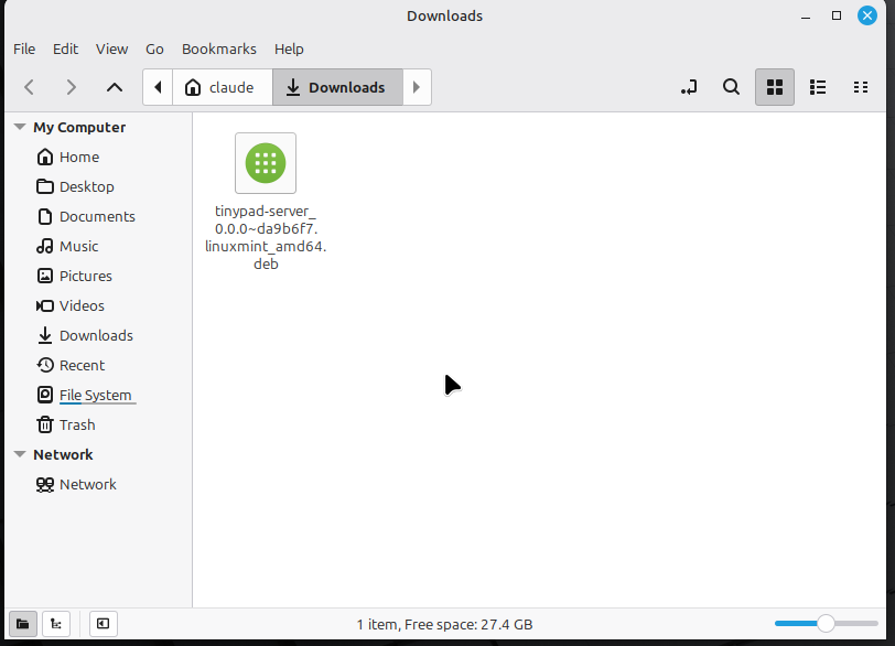 The Tiny Pad .deb package shown in the Files app Downloads folder on Linux Mint