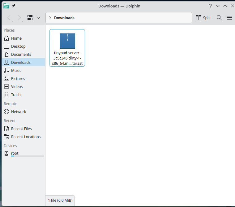 The Tiny Pad .pkg.tar.zst package shown in the Dolphin file manager Downloads folder