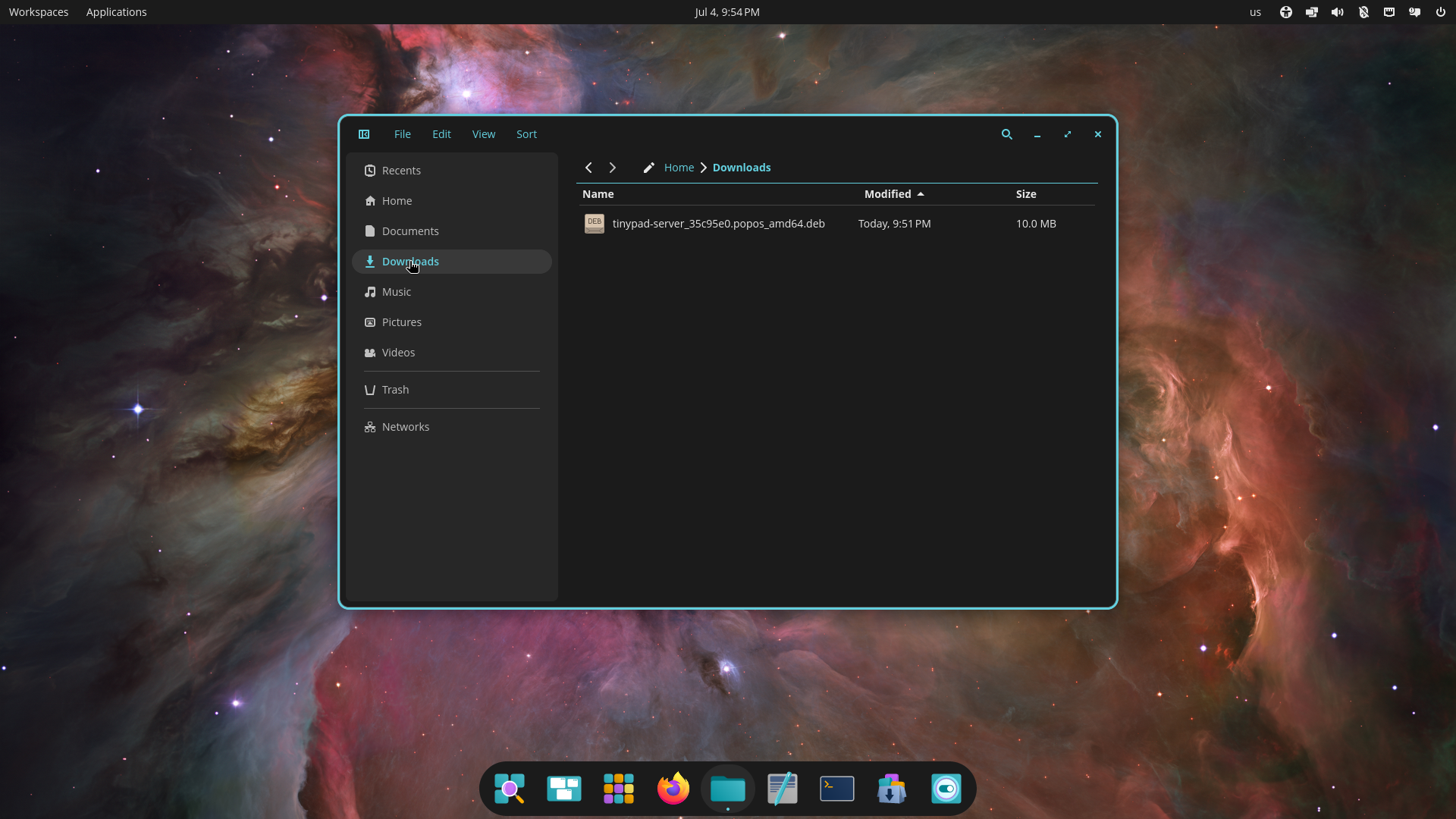 The Tiny Pad .deb package shown in the Files app Downloads folder on Pop!_OS